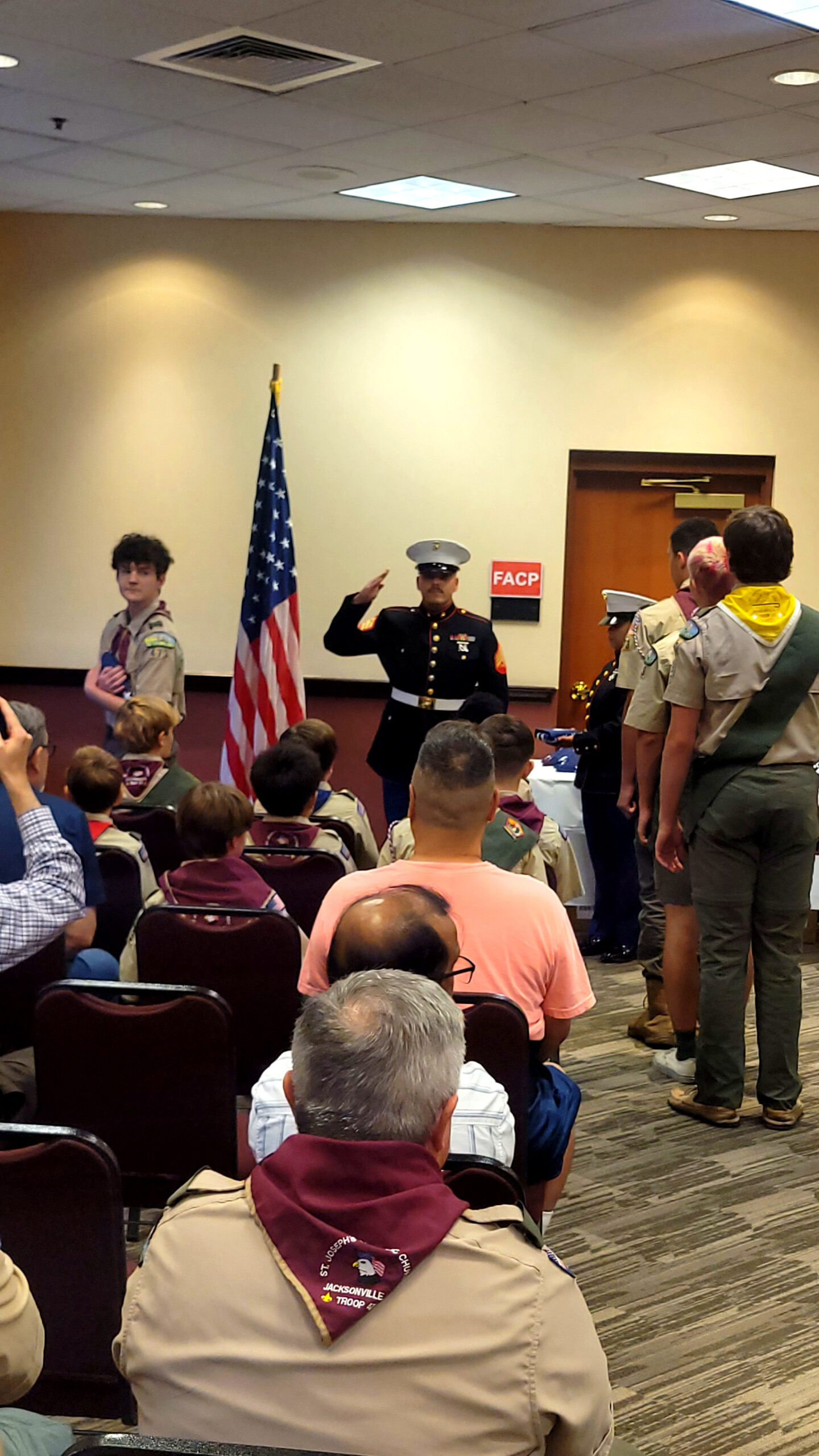 Marine recruiter addressing Scouts at the Jacksonville flag ceremony